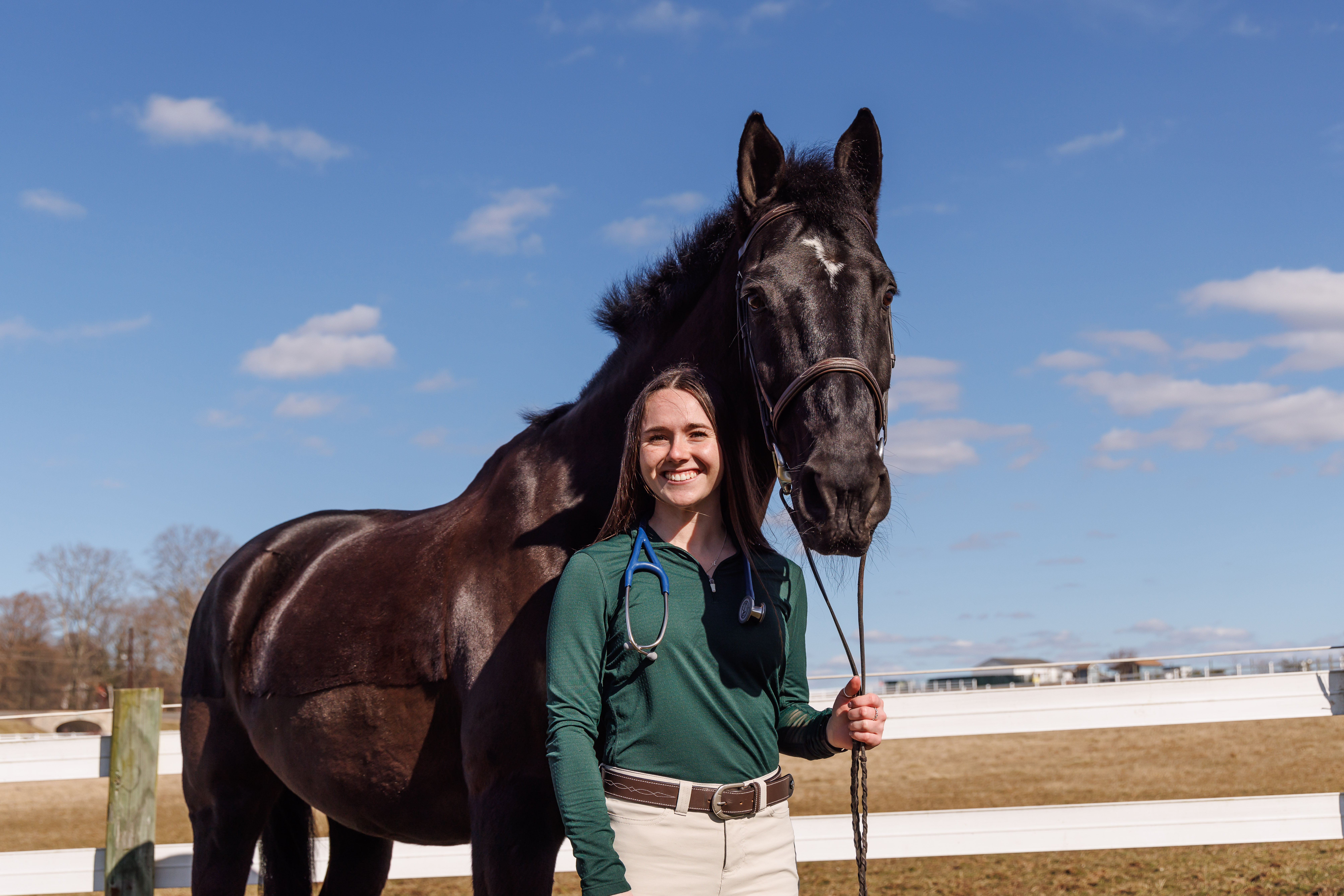 Nina Dellarte with a horse in the fields of DelVal.
