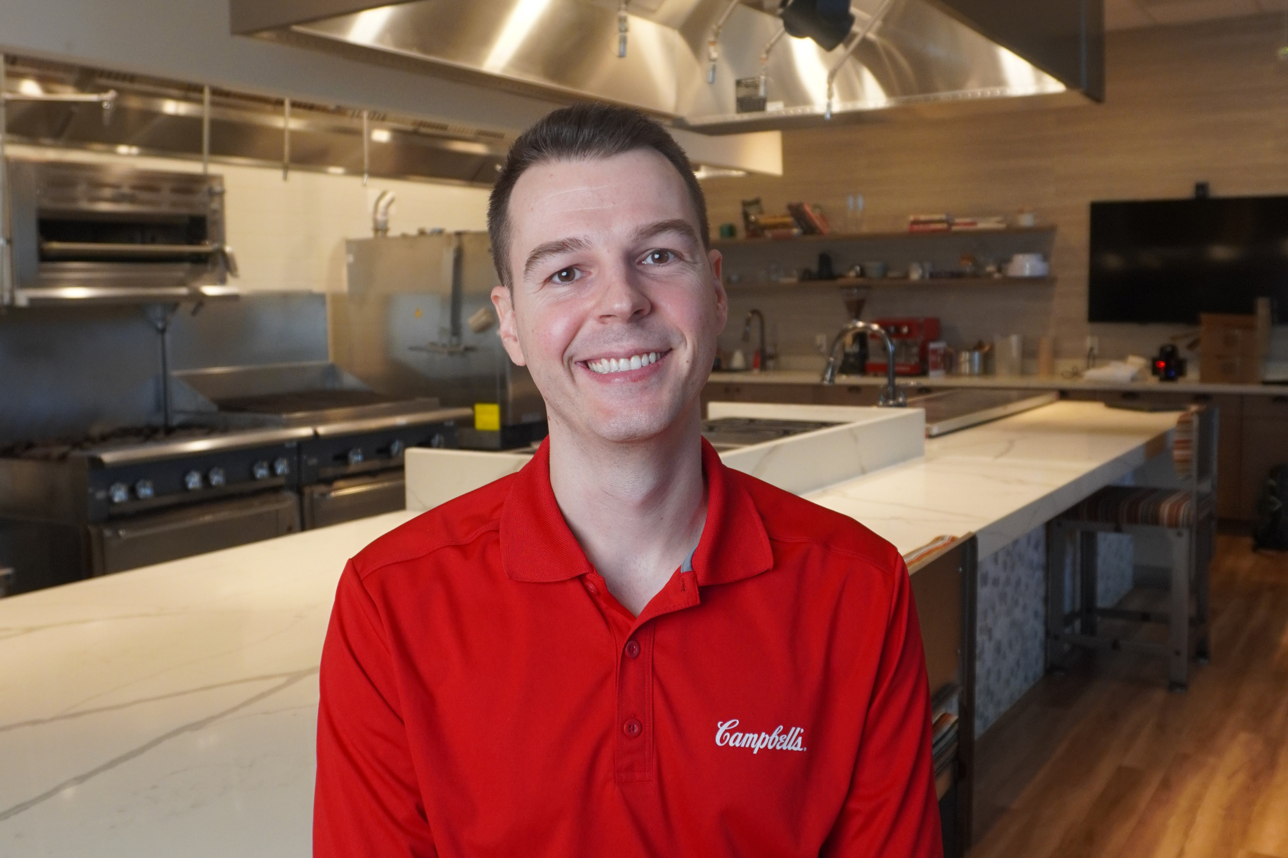 A headshot of Brian Cochetti in a campbell's kitchen setting. 