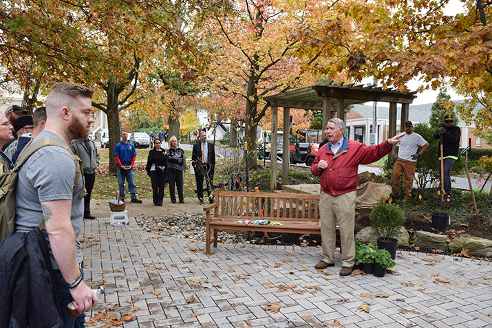 Kerr Smith speaking to a group at the dedication of the new garden