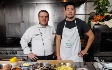Ryan Zellner and Nicholas Choi '25 on the set of the Chef's Kitchen