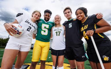 Five students from multiple sports pose in a group photo.