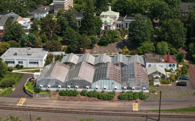 An aerial view of the greenhouses and main campus. 
