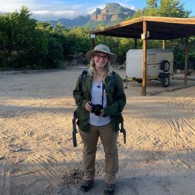 Alexa Apgar stands at a desert worksite