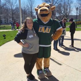 Bryanna Garnett stands with the ram mascot