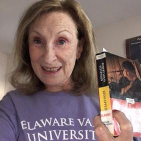 Susan Cerbone Holding a textbook.