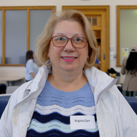 A headshot taken of Virginia Carr while on campus at a CLR event on campus in the library. 