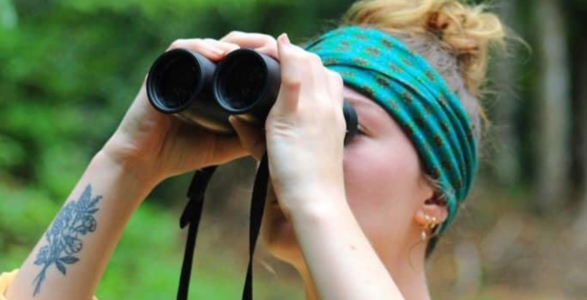 Student with binoculars