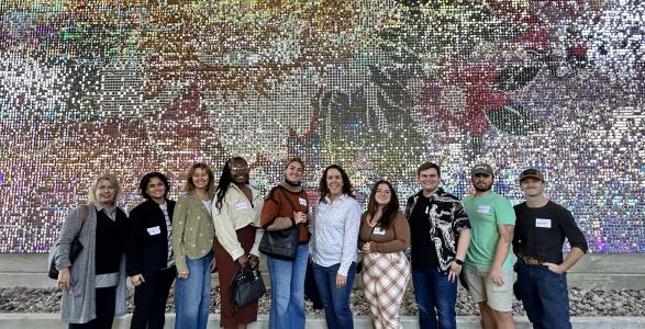 Students pose for a group photo with CSPD staff at URBN Headquarters.