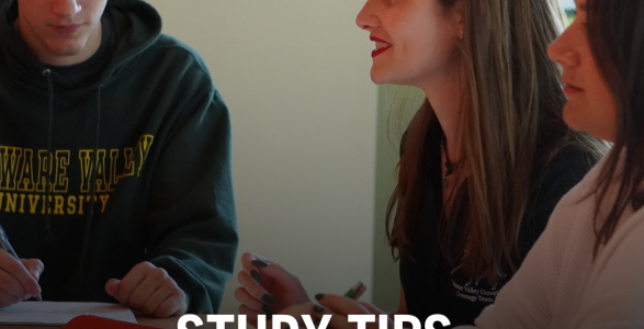 Students sit around a table in a study group