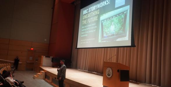 Dr. Ben speaking at the viewing of Unearthing the Future