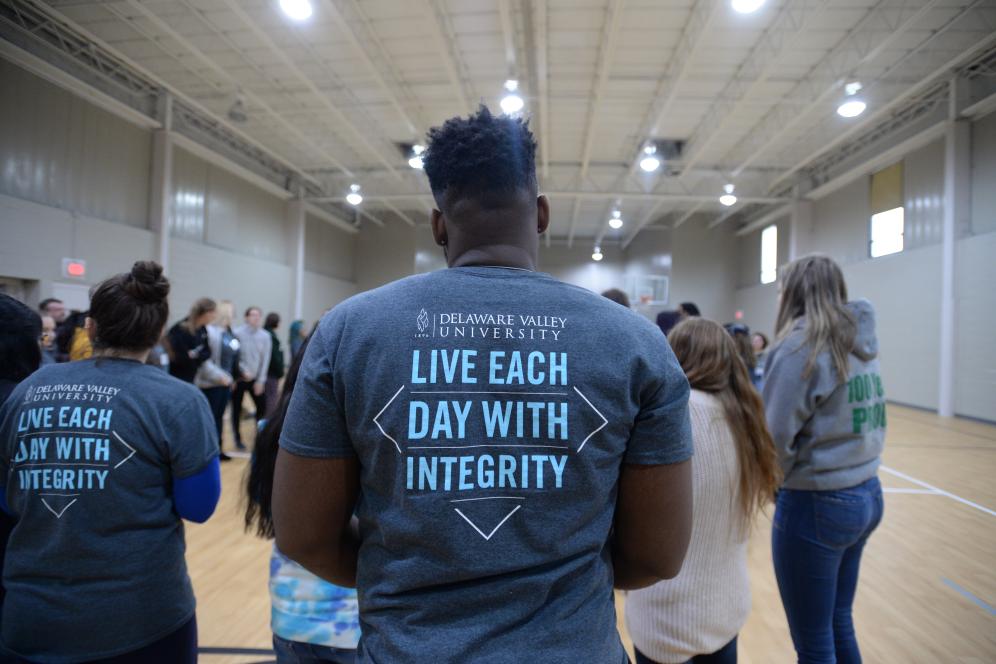 the back of student showing his Delaware Valley University shirt that reads Live Each Day with Integrity