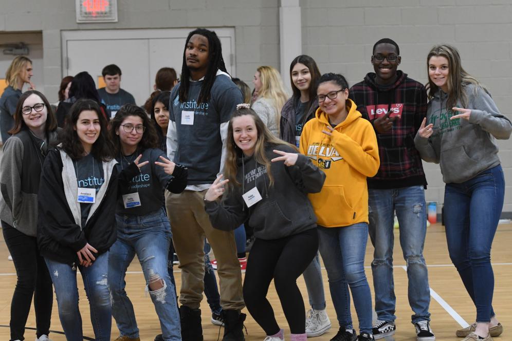 group of students posing in the gym