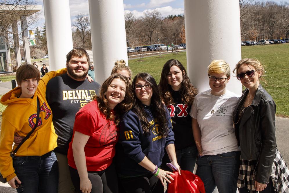 Group of students smiling on campus