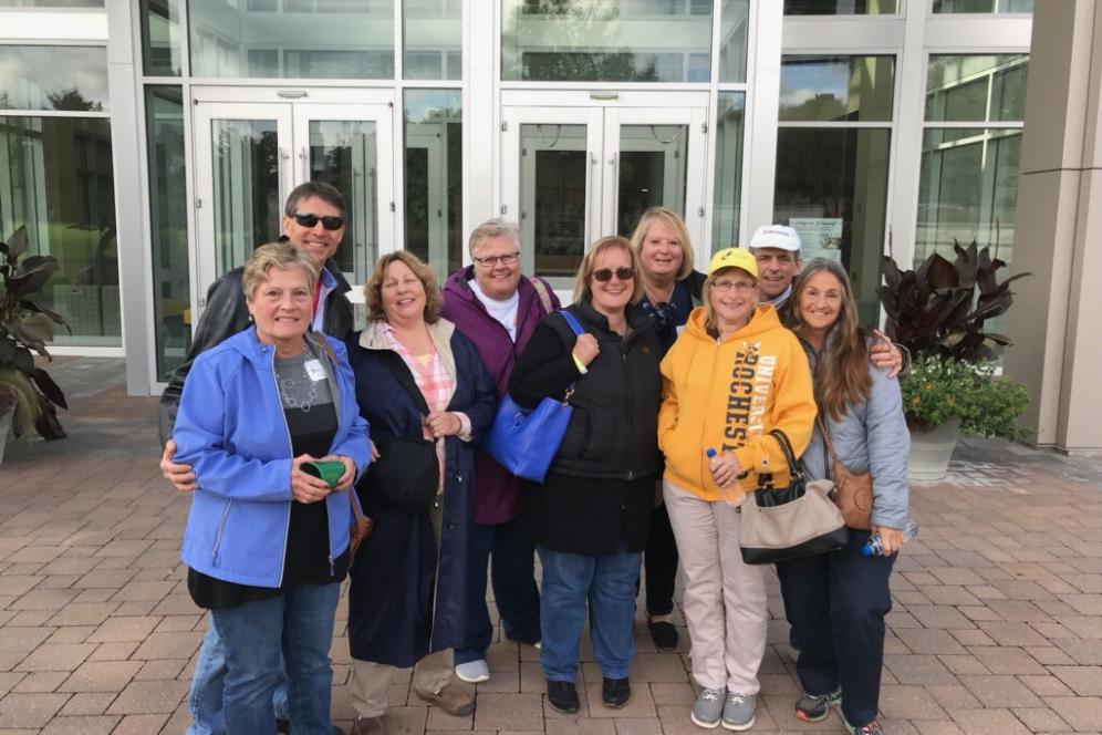 A group of classmates from 1978 standing outside the LSB building.