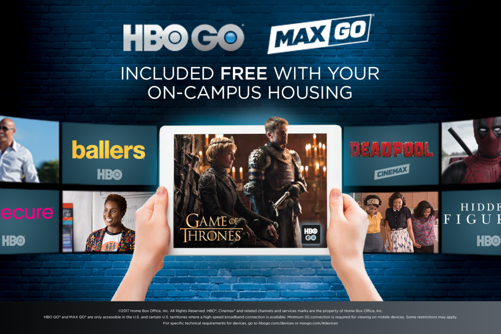 Two hands hold a tablet that is displaying information on HBO GO and MAX GO being included with on-campus housing. 
