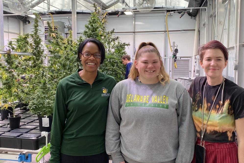 Students with provost in front of Cannabis