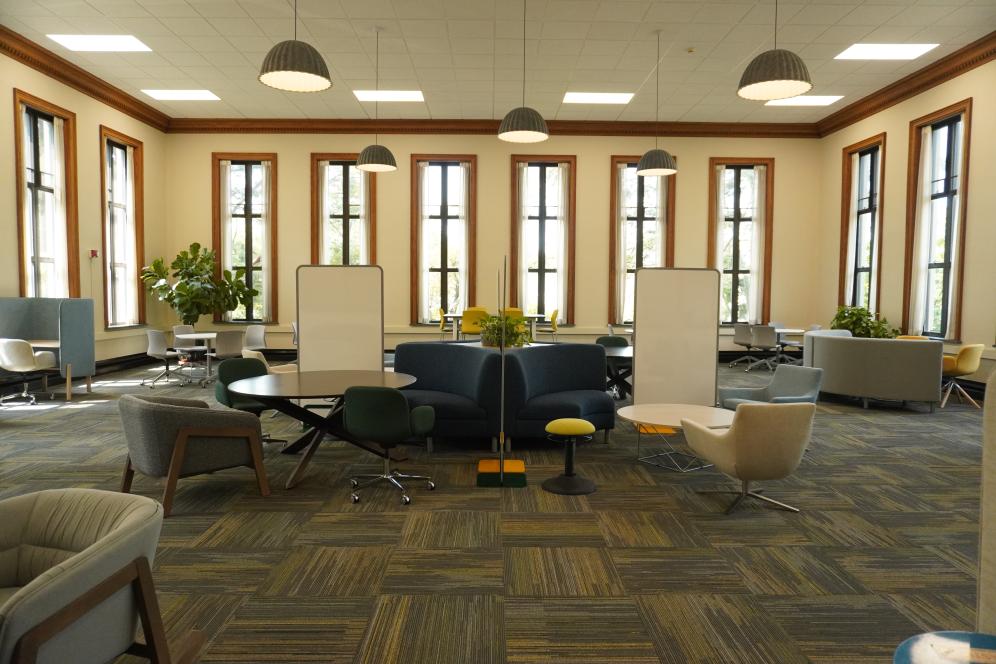 The Cooke Wing of the Library set up for group work with whiteboards, comfortable seating, and desk space. 