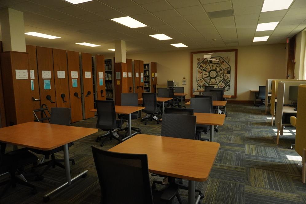 The lower level of the library with desks and seating, computers, and books after the renovations made possible by the Daniel Tanner Foundation.