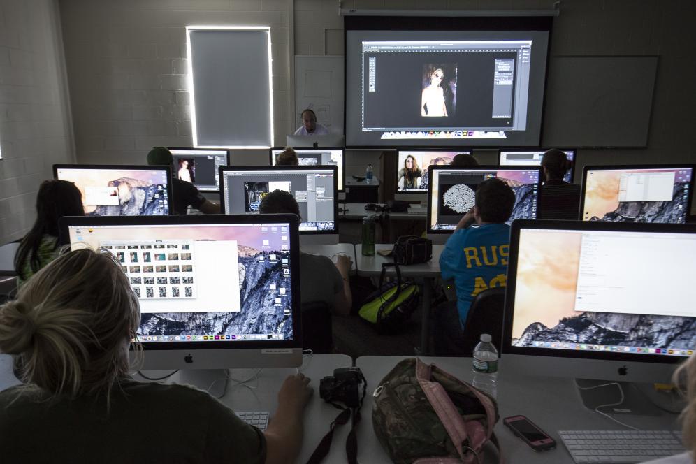 Doug McCambridge is teaching photoshop in the media lab. 