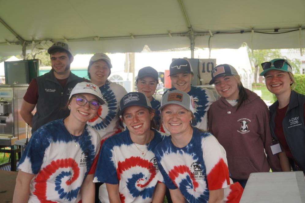Student Workers at the Milkshake Booth at A-Day gather for a photo.