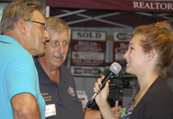 A DVU student interviewing 2 people