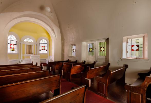 An interior view of the chapel, showing the alter and pews