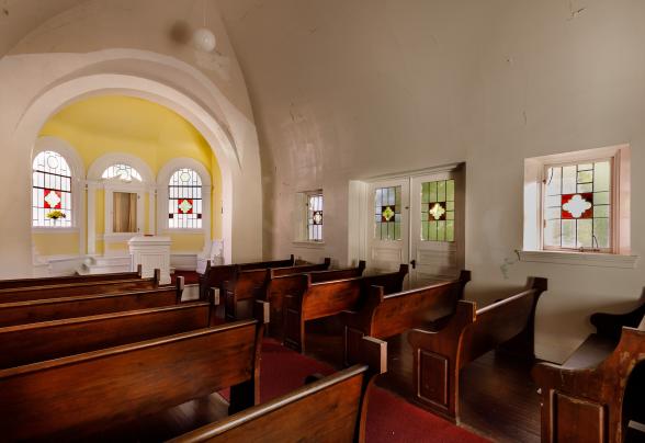 An interior view of the chapel, showing the alter and pews