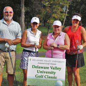 a group of golfers at the golf outing.