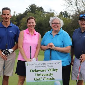 a group of golfers at the golf outing.