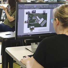 A student working on a site plan on a computer