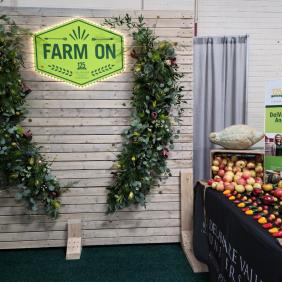 Farmshow booth sign and foliage 