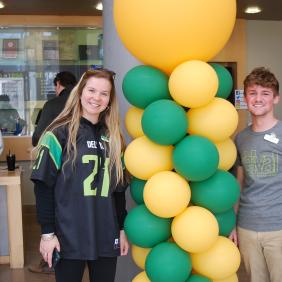 A mother and son at green and gold day 