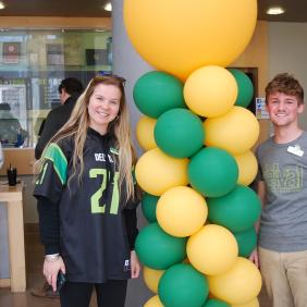 A mother and son at green and gold day