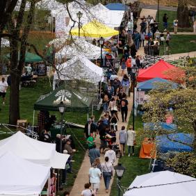 A view of the crowd and tents at A-Day from above. 