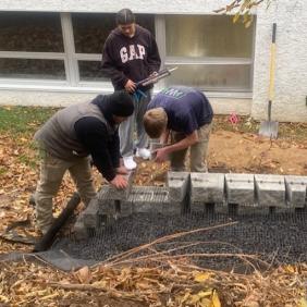 Students building a retaining wall during Landscape Construction class.