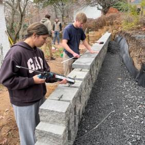 Students building a retaining wall during Landscape Construction class.
