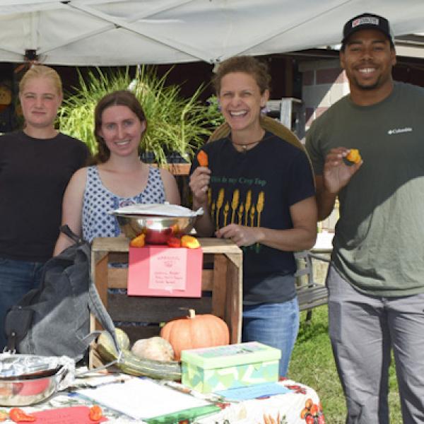 Four horticulture students at A Day stand