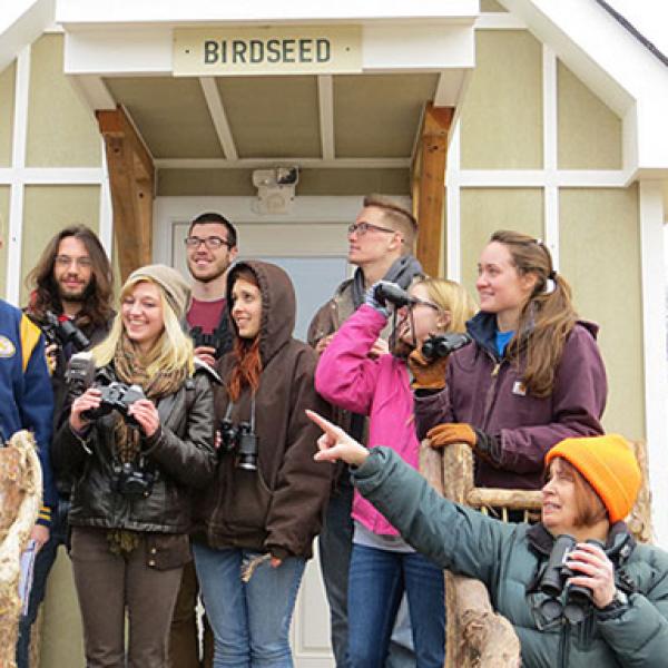 Students pose outside of a building