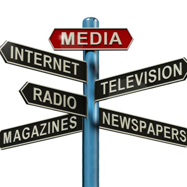 A multi-directional signpost, with points towards media, internet, television, radio, newspapers and magazines