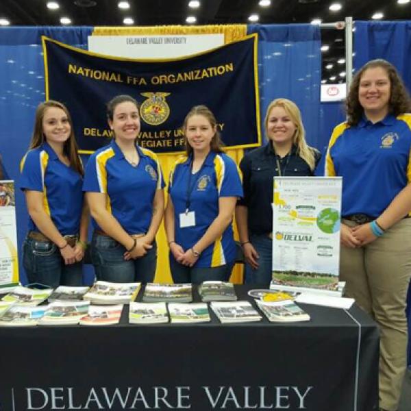 FFA students stand behind a DVU table