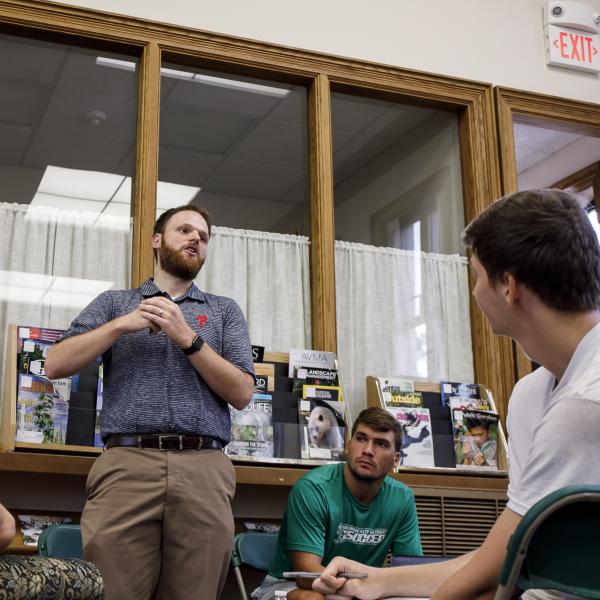 A man gives a presentation in front of a group