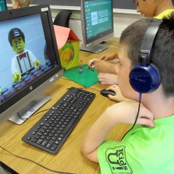 A kid in front of a computer