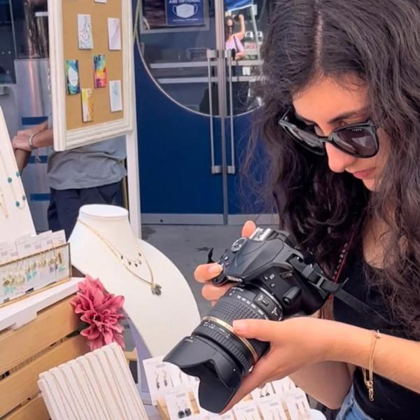 Maria Viola, a media student, is taking photos at a Doylestown boutique