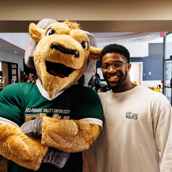 Caesar with student Julian White in the dining hall. 