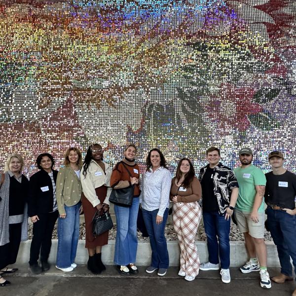 Students pose for a group photo with CSPD staff at URBN Headquarters.