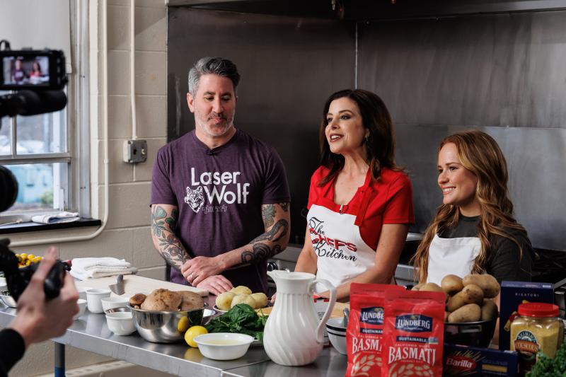 Chef Michael Solomonov and student Kyra McKeegan are talking into the camera during an episode. 