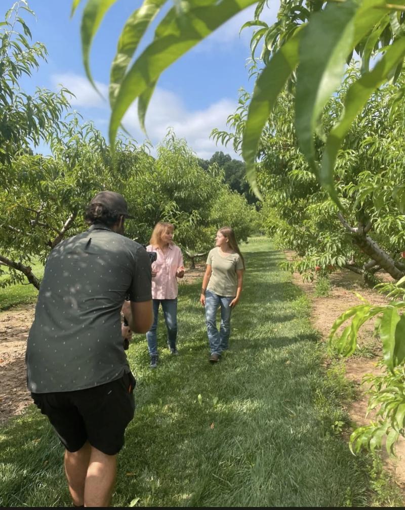 Behind the scenes photo of Dr. Jacqueline Ricotta and Charley Silfee '25 filming Unearthing the Future