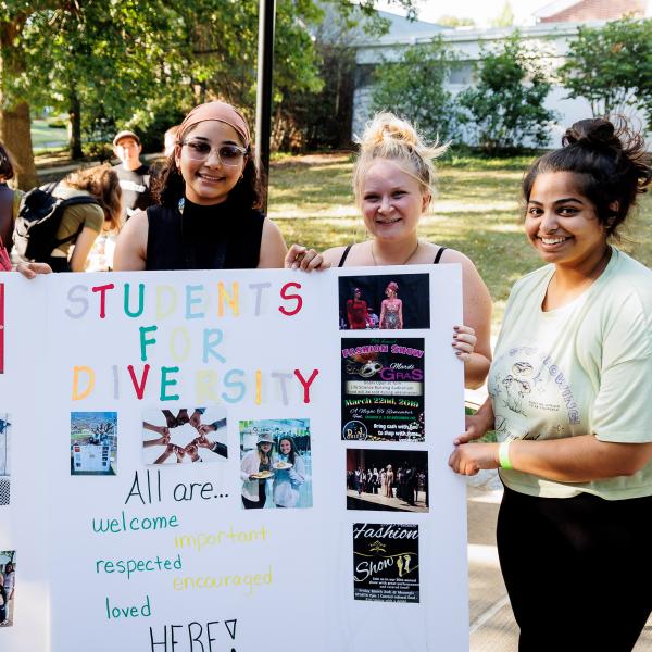 Students for Diversity Club students pose with their poster at the Clubs and Organizations expo. 