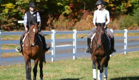 equine programs - two students on horseback 