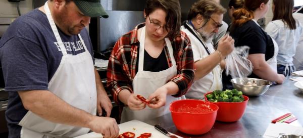 Students preparing bell peppers